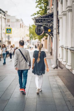 Abstract unrecognizable couple walking. Modern City life, love, lifestyle. Regular people out in public places