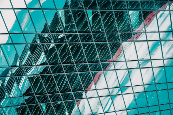 Abstract blurred reflection in facade of modern building, pattern of glass and concrete. — Stock fotografie