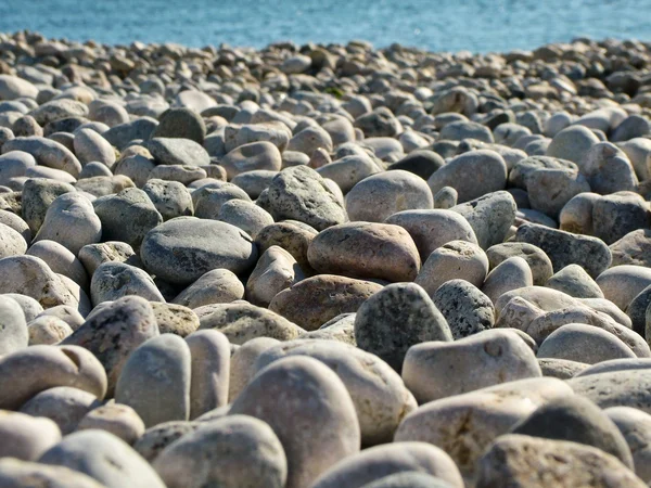 Kieselsteine am Strand, weicher Fokus — Stockfoto