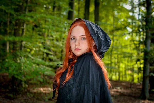 Beautiful Young Woman Long Red Hair Black Hood Cape Stands — Stock Photo, Image