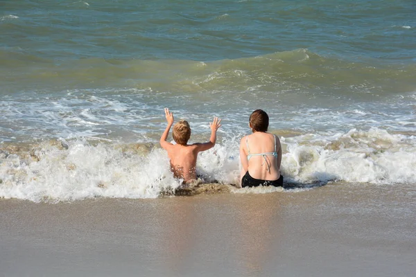Two Children Sit Full Joy Sandy Beach Middle Waves Sea — Stock Photo, Image