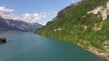 The beautiful Interlaken valley and Thunersee lake, Beatiful river at Switzerland in sunny day during summer, Aereal drone view of stunning idyllic nature scenery of lake Brienz with turquoise waters