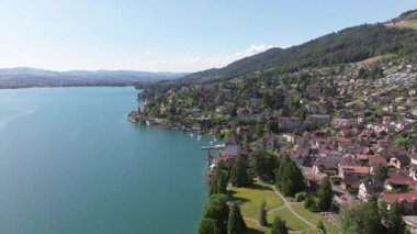 The beautiful Interlaken valley and Thunersee lake, Beatiful river at Switzerland in sunny day during summer, Aereal drone view of stunning idyllic nature scenery of lake Brienz with turquoise waters