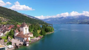 The beautiful Interlaken valley and Thunersee lake, Beatiful river at Switzerland in sunny day during summer, Aereal drone view of stunning idyllic nature scenery of lake Brienz with turquoise waters