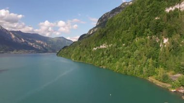 The beautiful Interlaken valley and Thunersee lake, Beatiful river at Switzerland in sunny day during summer, Aereal drone view of stunning idyllic nature scenery of lake Brienz with turquoise waters