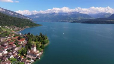 The beautiful Interlaken valley and Thunersee lake, Beatiful river at Switzerland in sunny day during summer, Aereal drone view of stunning idyllic nature scenery of lake Brienz with turquoise waters