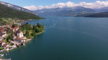 The beautiful Interlaken valley and Thunersee lake, Beatiful river at Switzerland in sunny day during summer, Aereal drone view of stunning idyllic nature scenery of lake Brienz with turquoise waters