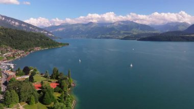 The beautiful Interlaken valley and Thunersee lake, Beatiful river at Switzerland in sunny day during summer, Aereal drone view of stunning idyllic nature scenery of lake Brienz with turquoise waters