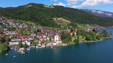The beautiful Interlaken valley and Thunersee lake, Beatiful river at Switzerland in sunny day during summer, Aereal drone view of stunning idyllic nature scenery of lake Brienz with turquoise waters