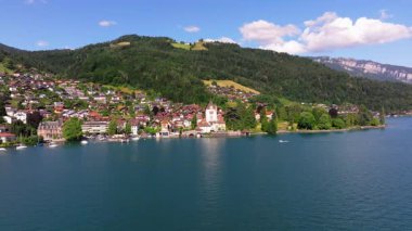 The beautiful Interlaken valley and Thunersee lake, Beatiful river at Switzerland in sunny day during summer, Aereal drone view of stunning idyllic nature scenery of lake Brienz with turquoise waters