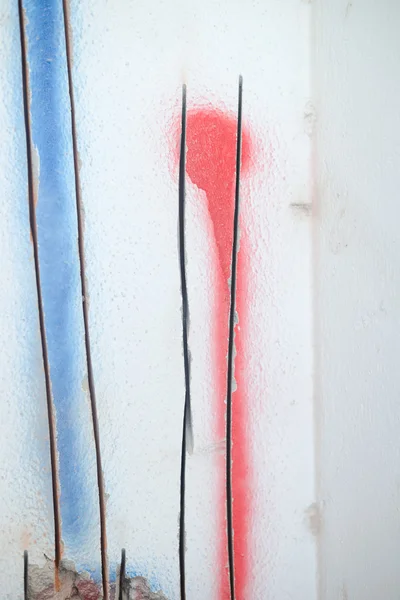 Closeup on concrete wall with exposed socket, procedure repair — Stock Photo, Image