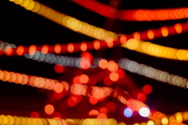 Soyut dairesel bokeh arka plan koyu arka plan üzerinde ışıkları