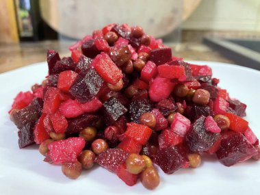 Vinaigrette - Ukrainian vegetable salad made from boiled beets, carrots and potatoes with the addition of onions, green peas, pickles and oil