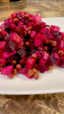 Vinaigrette - Ukrainian vegetable salad made from boiled beets, carrots and potatoes with the addition of onions, green peas, pickles and oil