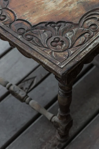 Old vintage wood dark table balinese style. Wood carving