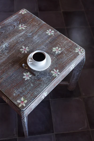 Black coffee on wooden table — Stock Photo, Image