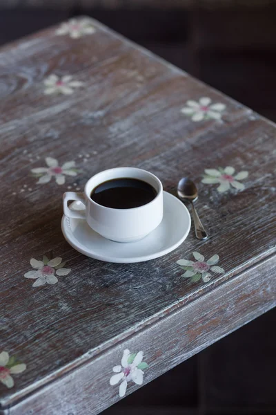 Black coffee on vintage table — Stock Photo, Image