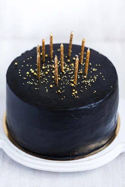 Birthday cake with golden candles — Stock Photo, Image