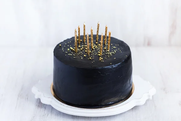 Birthday cake with golden candles — Stock Photo, Image