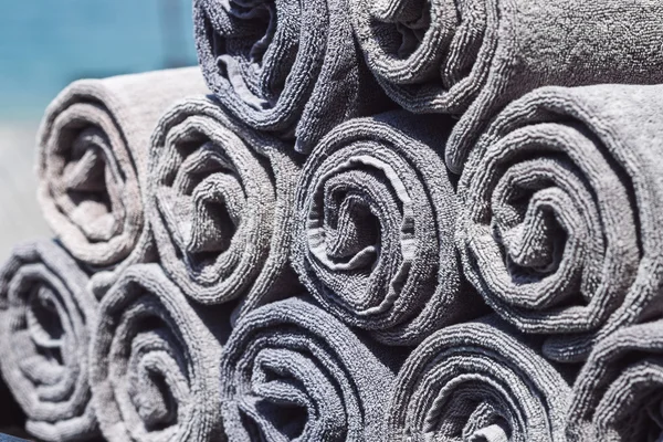 Stack of grey rolled towels