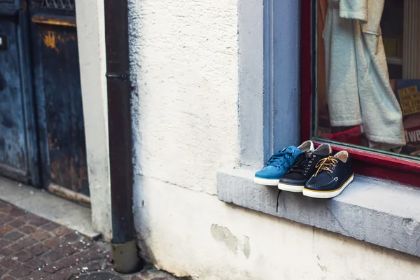 Shoes on the windowsill of store