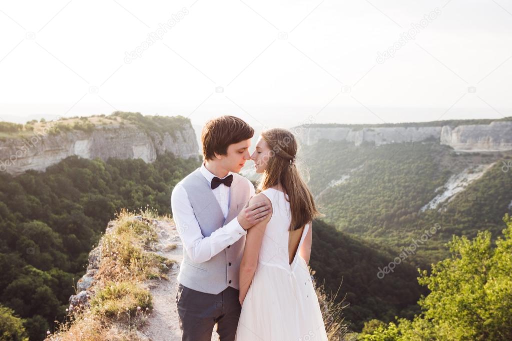 Newlyweds on walk in mountains