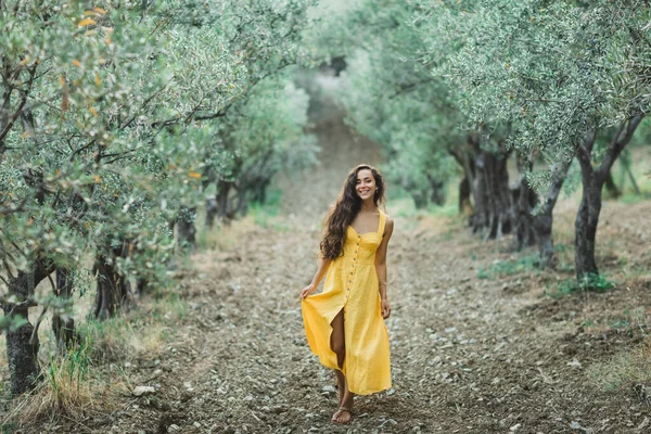 Young Happy Smiling Woman Walking Olive Tree Garden Yellow Linen Stock Photo