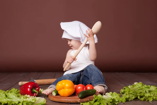 Young cook with large spoon. — Stock Photo, Image