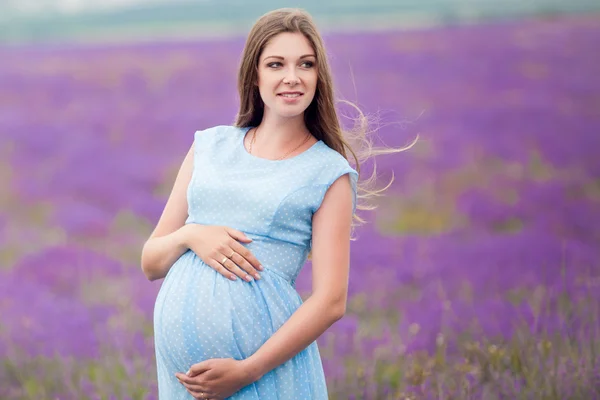 Pregnant girl in a lavender field — Stock Photo, Image