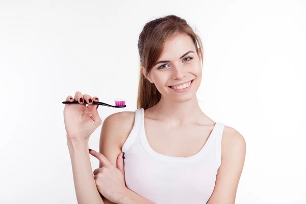 Girl with a toothbrush — Stock Photo, Image