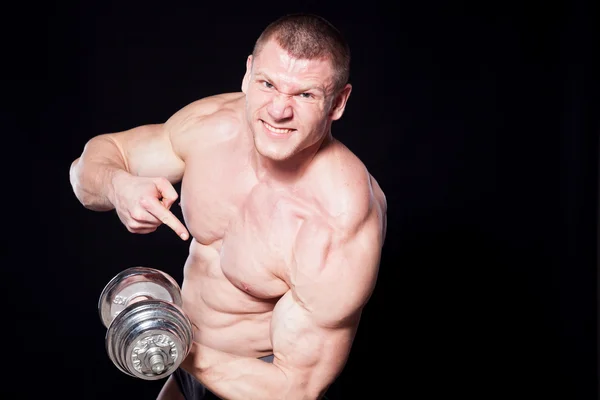 Male bodybuilder with dumbbells — Stock Photo, Image