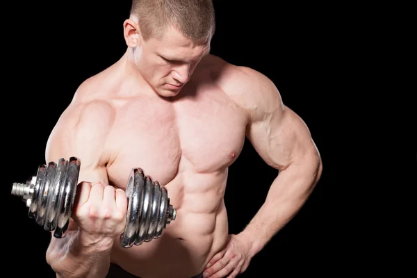 Male bodybuilder with dumbbells — Stock Photo, Image