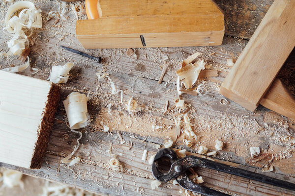 tools to work with the carpenters wood on the table as a background