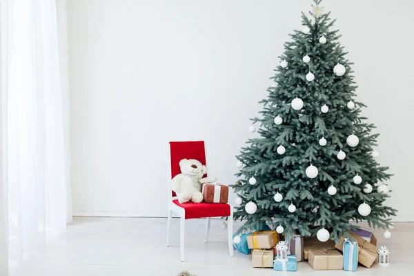 New Years card interior red decor and Christmas tree with white gifts — Stock Photo, Image