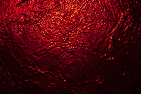 подсветка в красной черной текстуре стены в качестве фона