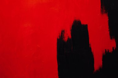 Yapı dokusu arkaplanından kırmızı boyalı siyah duvar