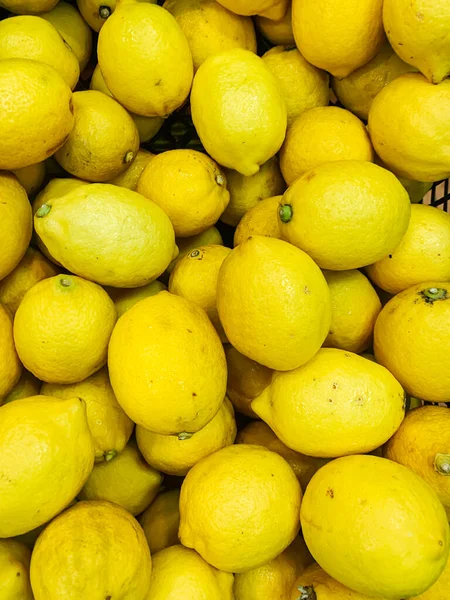 Lotes de limões amarelos maduros para cozinhar como fundo — Fotografia de Stock