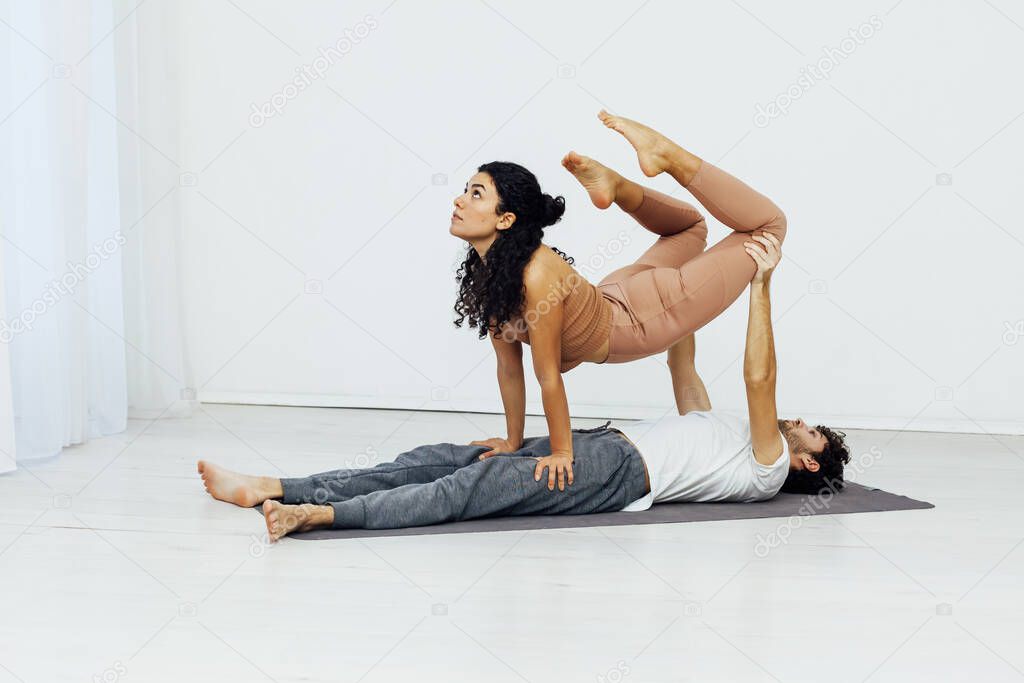 Male and female paired yoga asana gymnastics fitness