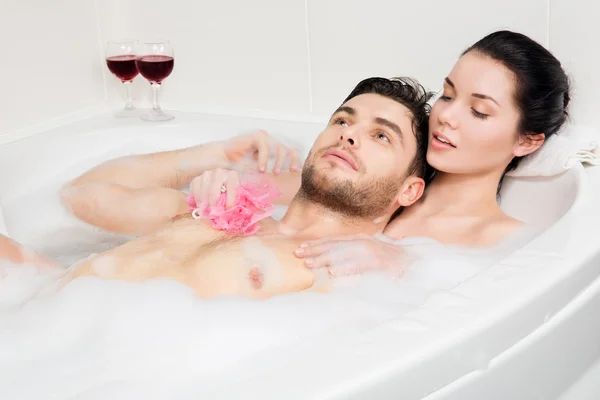 Beautiful couple is taking a bath — Stock Photo, Image