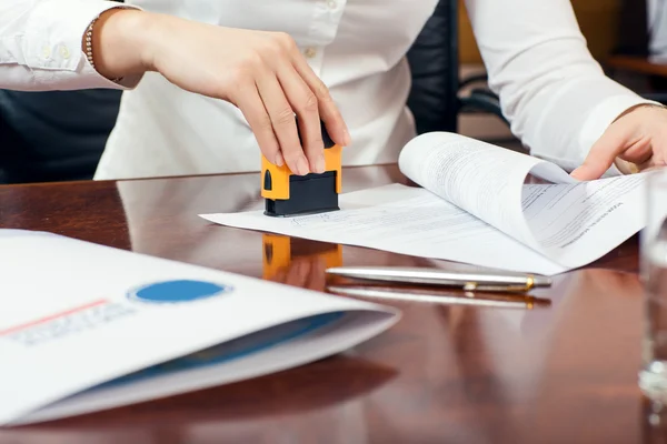 Female hand with stamp — Stock Photo, Image