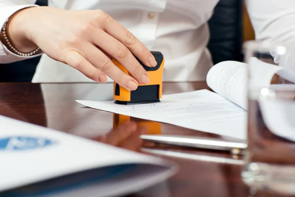 Female hand with stamp — Stock Photo, Image