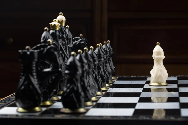 Battle boy playing chess — Stock Photo, Image