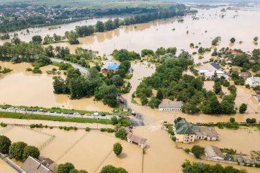 Aerial view of flooded houses with dirty water of Dnister river in Halych town, western Ukraine. clipart