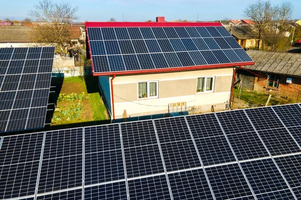 Private house with ground located solar photovoltaic panels for producing clean electricity. Autonomous home concept.