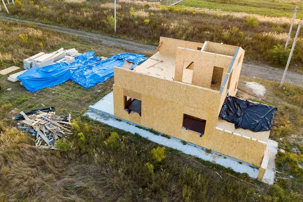 Construction of new and modern modular house. Walls made from composite wooden sip panels with styrofoam insulation inside. Building new frame of energy efficient home concept.