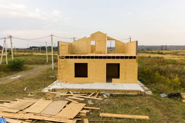 Construction of new and modern modular house. Walls made from composite wooden sip panels with styrofoam insulation inside. Building new frame of energy efficient home concept.