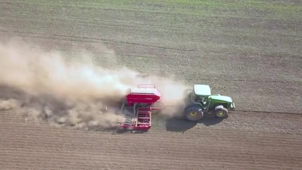 Top Aerial View Green Tractor Cultivating Ground Seeding Dry Field — Stock Video