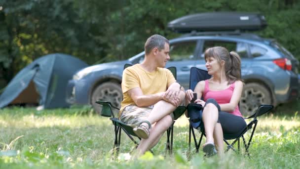 Young Couple Sitting Camping Site Talking Happily Together — Stock Video