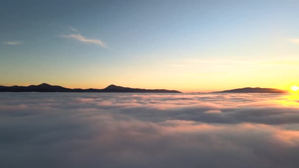 Aerial View Vibrant Yellow Sunrise White Dense Clouds Distant Mountains — Stock Video