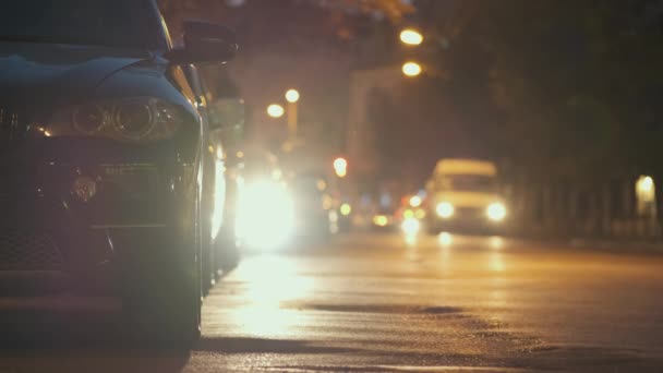 Close Parked Cars Roadside Night Blurred View Traffic Lights Moving — Stock Video